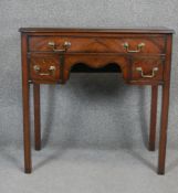 A Georgian style mahogany and crossbanded lowboy on square section supports. H78 W75 D37