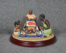 A Thomas Blackshear's figure group, Ebony Visions, The Threads that Bind, boxed.