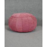 A vintage blush pink suede Moroccan style pouffe.