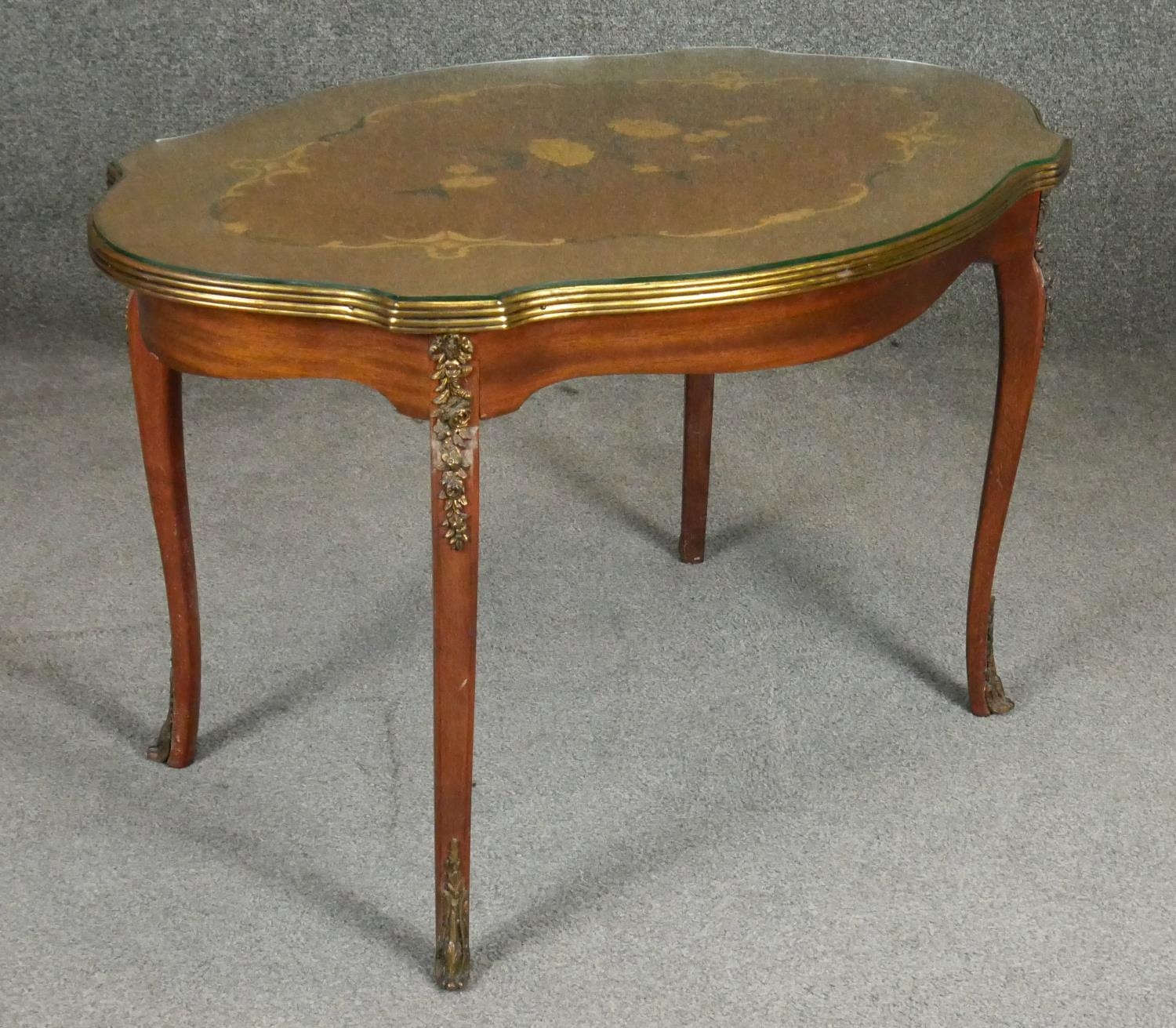 An Italian walnut and floral inlaid occasional table with shaped glass top on ormolu mounted - Image 2 of 5