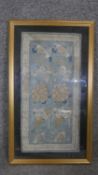 A framed and glazed Chinese silk antique floral embroidery with forbidden stitch. H.56 W.33cm