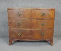 A Regency flame mahogany bow fronted chest of drawers on swept bracket feet. H.87 W.103 D.50