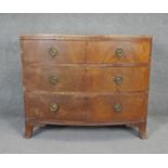 A Regency flame mahogany bow fronted chest of drawers on swept bracket feet. H.87 W.103 D.50