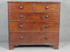 A 19th century mahogany chest with turned knob handles on shaped bracket feet. H97 W103 D50