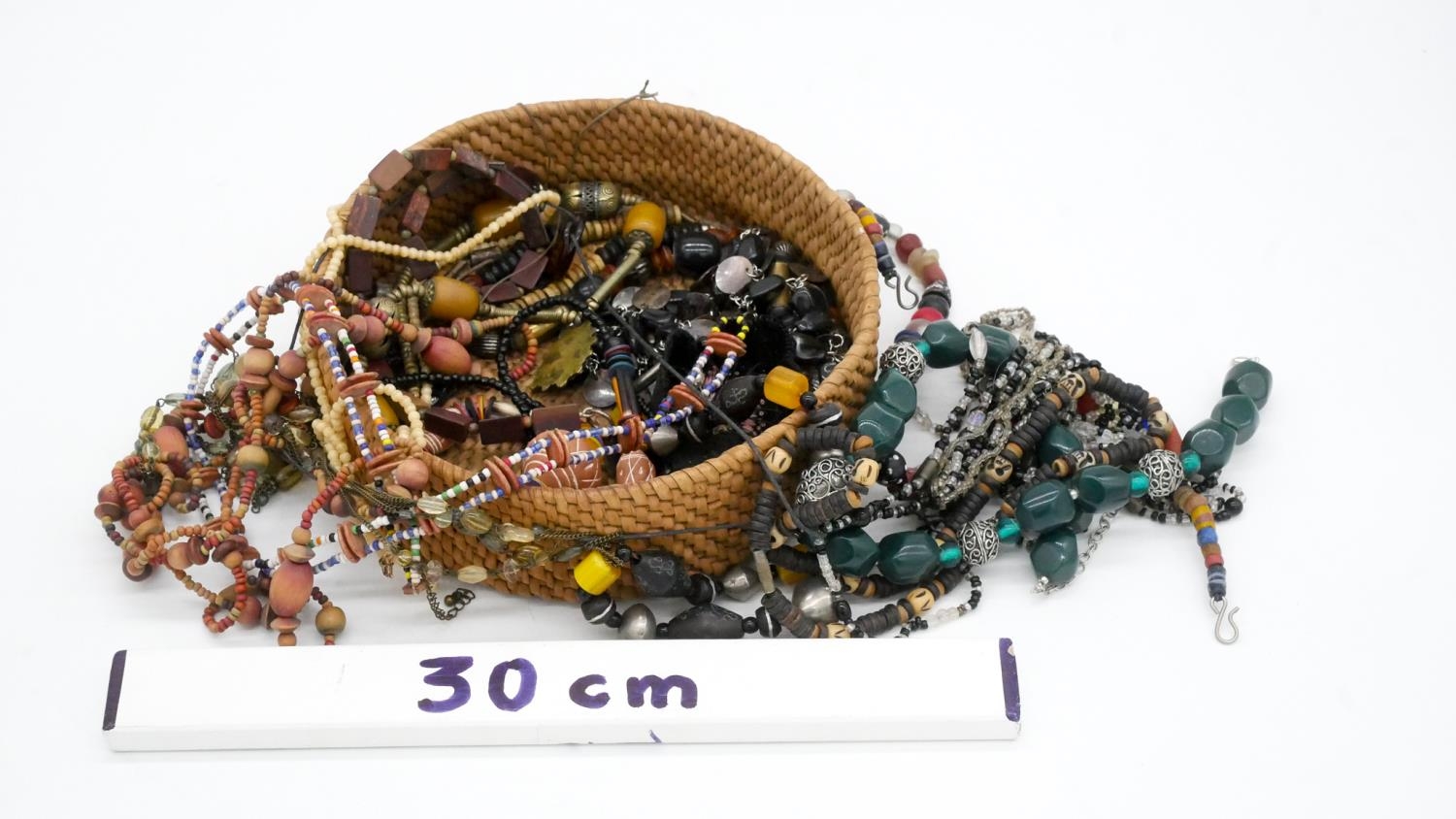 A collection of costume jewellery. Inluding a tribal cane glass bead necklace and other necklaces. - Image 6 of 6