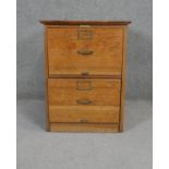 A C.1900 oak two drawer filing chest with maker's label and original brassware. H.70 W.54 D.74cm