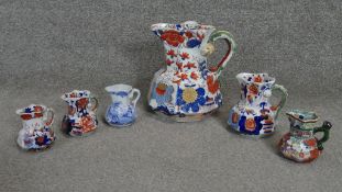 A collection of six 19th century Mason's ironstone hand painted Hydra jugs. One of very large size