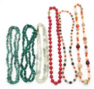 A collection of six gemstone and lacquer necklaces. Including a double stranded faceted green