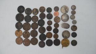 A collection of forty six British and world coins and medals. Including some silver and Georgian