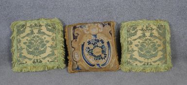 A pair of satin and velvet cushions along with an Aubusson cushion.