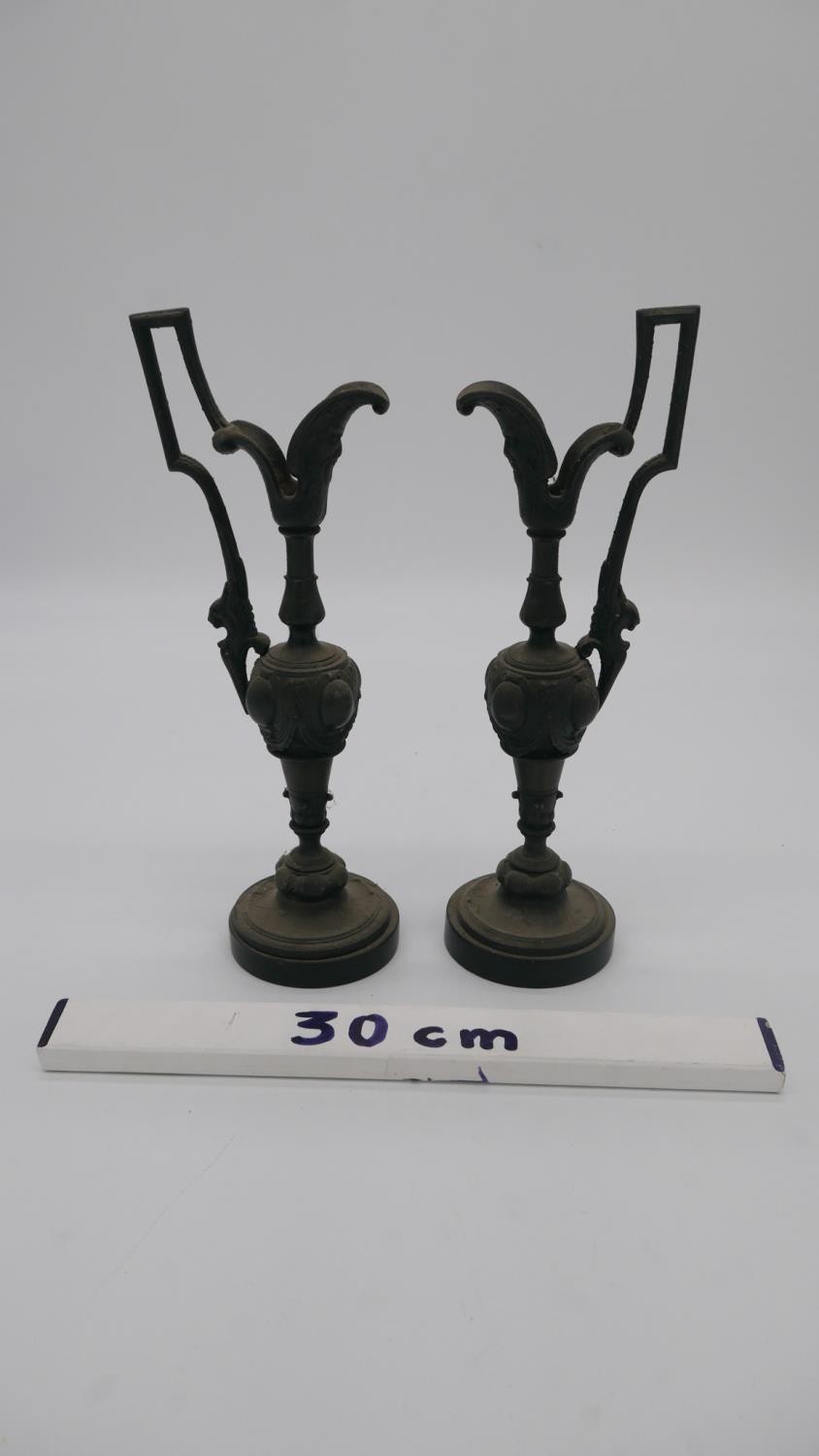 A pair of bronze handled urn form candle sticks on balck marble bases. H.30cm - Image 2 of 3