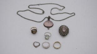 A collection of silver jewellery. To include a silver Victorian locket, a rose quartz pendant with