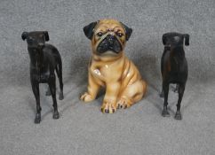 A pair of vintage cast iron greyhound statues along with a ceramic painted bulldog.