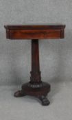 A William IV rosewood work table with twin pull out slides on acanthus carved pedestal base