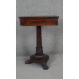 A William IV rosewood work table with twin pull out slides on acanthus carved pedestal base