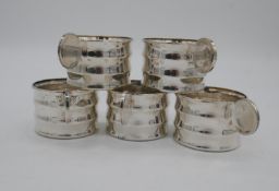 A set of five silver plated Art deco style tumbler holders, marked to the base.