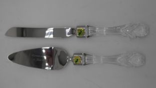 A boxed set of Waterford crystal handled cake servers with steel blades. Makers label on collar.
