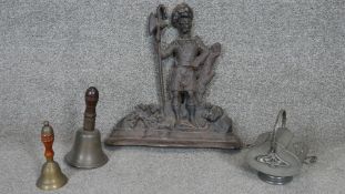 A collection of metalware. Including a cast iron door stop of a knight, along with two hand held