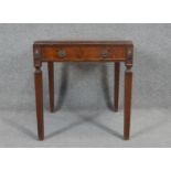 A Georgian style mahogany lamp table on fluted square tapering supports. H.60 W.55 D.55cm