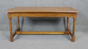 A mid century light oak coffee table in the antique style. H.46 W.94 D.48cm