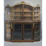 A mid Victorian rosewood and giltwood credenza, circa 1850, the upper section with a shell and