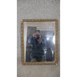 A wall mirror in gilt gesso frame. H.50 W.39cm