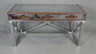 An Andrew Martin style mirrored and leather travel trunk style bound console table on brushed