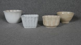A collection of four Victorian ceramic jelly moulds.