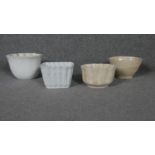 A collection of four Victorian ceramic jelly moulds.