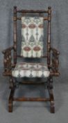 An American painted frame child's rocking chair in Arts and Crafts style upholstery. H.74 W.40cm