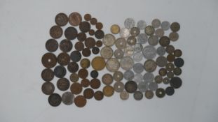 A large collection of British and world coins and medals. Including some silver and European coins.