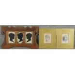 An Art Nouveau oak frame with three silhouette paper cut outs of children along with two lithographs