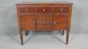 A late Georgian mahogany washstand with lift up top enclosing open compartment above dummy drawers