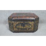 A 19th century lockable Chinese gilded lacquer tea box with engraved pewter lidded partitions.
