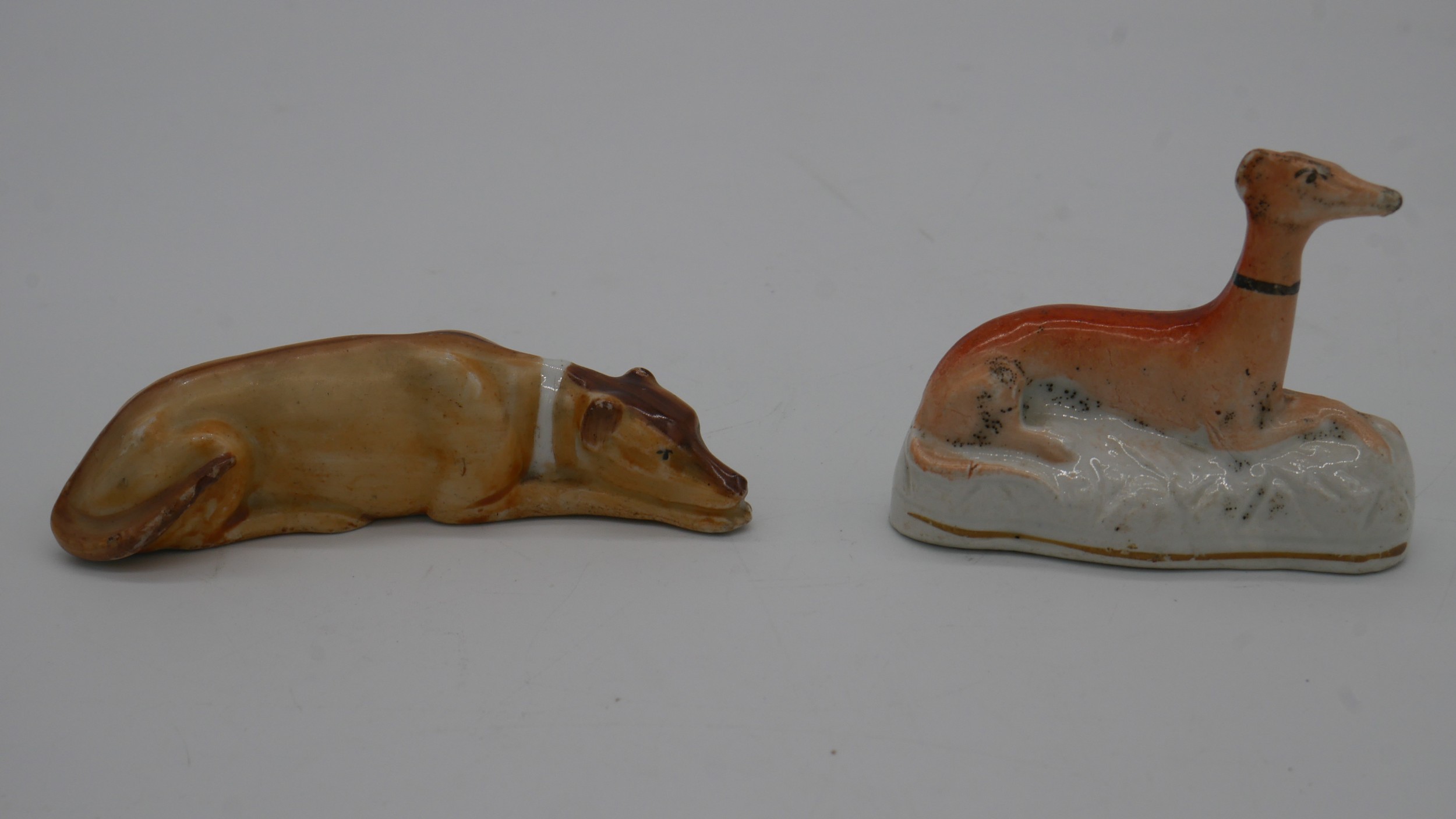 A collection of 19th century ceramic hand painted dogs. Including a pair of reclining grey hounds - Image 3 of 4
