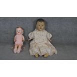 Two vintage dolls. A vintage composition doll by DEE and CEE, Canada in a night dress along with a