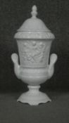 A Pereiras ceramic Portuguese white glazed Classical design two handled lidded urn. Makers stamp