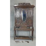 A late 19th century carved oak hallstand in the Jacobean style with original drip trays. H.210 W.110