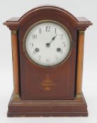 A C.1900 mahogany cased mantel clock with Classical urn and husk swag inlay. H.31cm