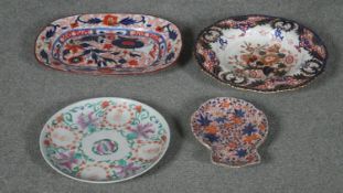 A collection of Oriental porcelain. Including three imari hand painted plates and a famille rose