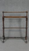 A 19th century mahogany towel rail on barleytwist supports. W.78 H.88 D.32