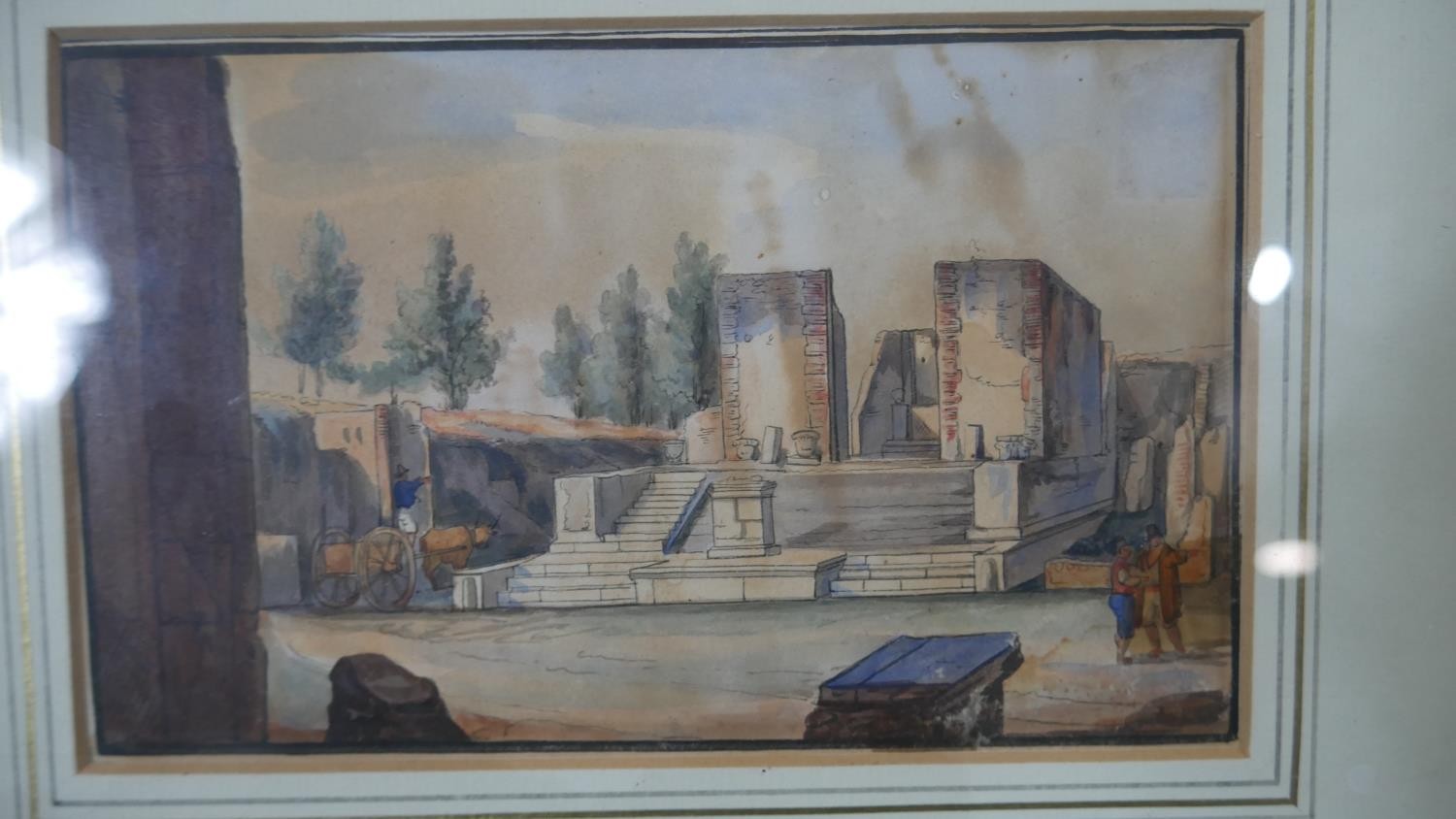 A 19th century framed and glazed watercolour, figures in Classical ruins, unsigned. H.29 W.36cm