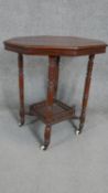 A 19th century mahogany occasional table on turned tapering supports united by galleried