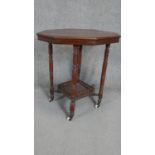 A 19th century mahogany occasional table on turned tapering supports united by galleried