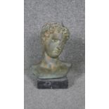 A Classical style bronze bust on marble base.