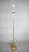 A vintage solid brass candle design height adjustable standard lamp with ridged circular base.