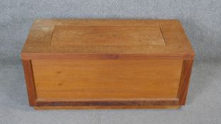 A modern teak lidded storage box or planter. H.45 W.100 D.45cm