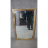A gilt framed wall mirror. H.122 W.46cm