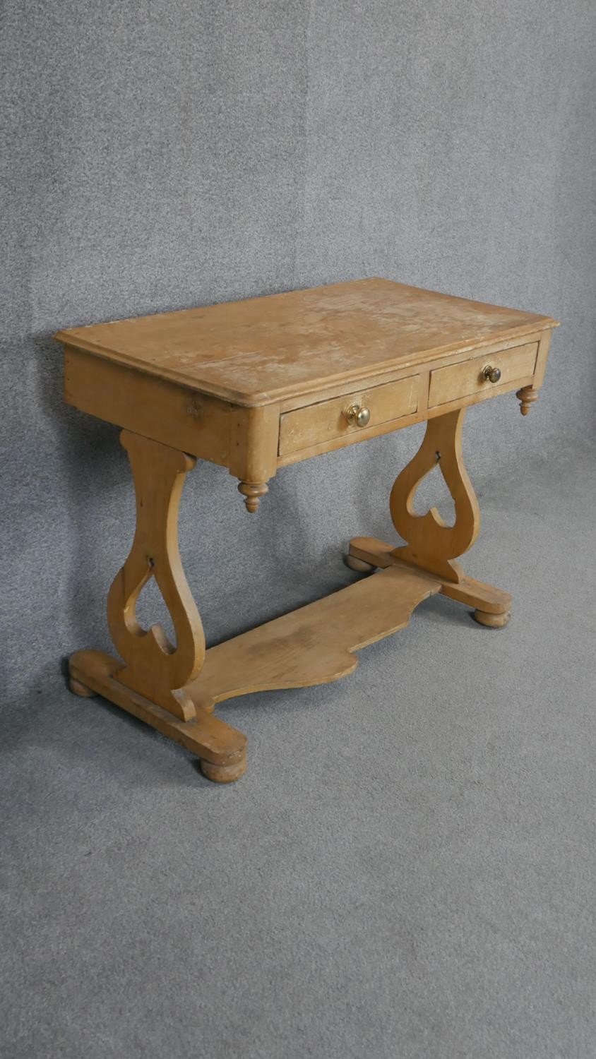 A 19th century pine two drawer side table on stretchered shaped supports. H.78 W.101 D.53cm - Image 3 of 4