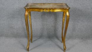 An Italian gilt occasional table with shaped top on slender cabriole supports. H.58 W.54 D.34cm